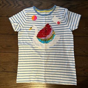 Sequin shirt goes from colorful to gold swan